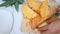 Close up shot hands of women using kitchen knife to cutting and peeling ripe pineapple shallow depth of field with ambient sound