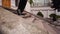 Close up shot of hurry businessman in black formal suit feet in loafer's shoes walking down marble stairs of luxury