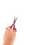 Close-up shot of an isolated mans hand holding red scissors