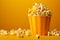 close-up shot of large popcorn cup overflowing with classic movie theater popcorn snack