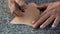 Close-up shot of a leather worker\'s hands painted cowhide decoration Expertly paint beautiful patterns to trim and trim. A