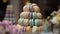 a close-up shot of a macaron tower in pastel colors, with a blurred background of floral decorations. Generative AI