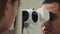 Close up shot of a man`s face, people working as an ophthalmologist