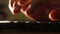 Close up shot of man typing on laptop keyboard; backlit; news, writer, media or communication