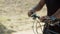 Close-up shot of mans hands holding handlebar of bicycle