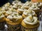 Close up shot of many cakes with cream and Pine nuts