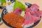 Close up shot of many salmon roe, fish sashimi with perilla leaf