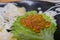 Close up shot of many salmon roe with perilla leaf