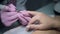 Close-up shot of master uses an electric machine to remove the nail polish during manicure in the salon. Hardware