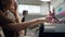 Close-up shot of master uses an electric machine to remove the nail polish during manicure in the salon. Hardware