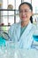 Close up shot, Middle-Age Asian female scientists, Wearing glasses and hand holding a magnifying glass