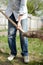 Close up shot middle age man with shovel holding soil. Gardening and building concept