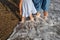 close-up shot, mother and daughter walking barefoot along the seashore