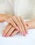 Close up shot of nicely manicured woman fingernails