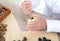 Close-up shot of an old Chinese doctor using a medicine mortar to smash Chinese herbs