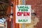 Close up shot of an old sign of Local Food Daily store