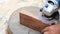 Close up shot  of old worker hands carpenter equals polishes wooden board with a random orbit sander in the workshop, sanding
