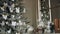 Close-up shot of perfect Christmas decoration mantel with accessories and green New Year tree with silver balls and