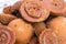 Close up shot of a pile of delicious round Jaggery with sitting flies on a street market