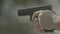 Close-up shot of a pistol. Shooting