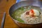 Close-up shot of  plate of pyongyang naengmyeon noodles and chopsticks on teh wooden table