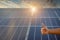 Close-up shot poses positive gesture on solar panel photovoltaic On the roof of the house and with a thumbs up or like Money