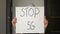 Close up shot of poster `STOP 5G` which people use in demonstration against 5G, shot with 1.33x anamorphic lens