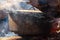 A Close-Up Shot Of Pot On A Campfire Surrounded By Smoke