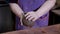 Close up shot of a pottery master`s hands shaping a big ball out of clay.