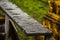 Close-up shot of the raindrops on the iron long tray at Wat Anuphatkritdaram, Phuket Thailand