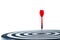 Close up shot red dart arrow on center of dartboard Isolated on