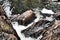 Close-up shot of a river collapsing with rocky landscape and flowing through it