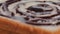 Close-up of a shot of rotating chocolate and condensed milk on a piece of bread