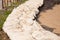 Close up shot of sandbags stacked in row as barrier to protect catastrophe, such as flooding and hurricane, which is caused by