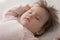 Close up shot serene peaceful baby sleeping lying on bed