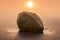 Close up shot of a single lonely coconut lying in sand on a beach at sunset with background bokeh