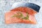 Close-up shot of sliced salmon fillet on crushed ice