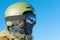 Close up shot of snowboarder in goggles with reflection of snowed mountains in it