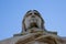 Close up shot of a statue of Jesus Christ, Cristo Rei, standing atop a hill in Lisbon, Portugal