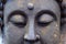 Close-up shot of the stone Buddha`s eye.