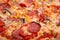 Close-up shot of tasty American pizza with pepperoni and mushrooms