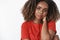 Close-up shot of tender and gentle romantic african-american girlfriend in red casual t-shirt touching back of neck shy