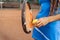 A close-up shot of a tennis ball and racket. The tennis player prepares to serve during the match. A beautiful sport that requires