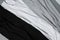 Close up shot of three monochrome cotton t shirts mock up on gray background