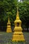 Close-up shot of the two golden stupa at Wat Anuphatkritdaram, Phuket Thailand. Religion photography