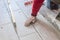 Close up shot of unfinished floor tiles installation in kitchen