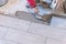 Close up shot of unfinished floor tiles installation in kitchen