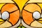 Close-up shot of varicoloured stained glass window backlit by the sun. Part of a yellow-orange stained glass window with large