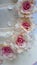 Close up shot of vintage sugar roses on a wedding cake