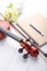 Close-up shot violin headstock orchestra instrumental over white wooden background select focus shallow depth of field